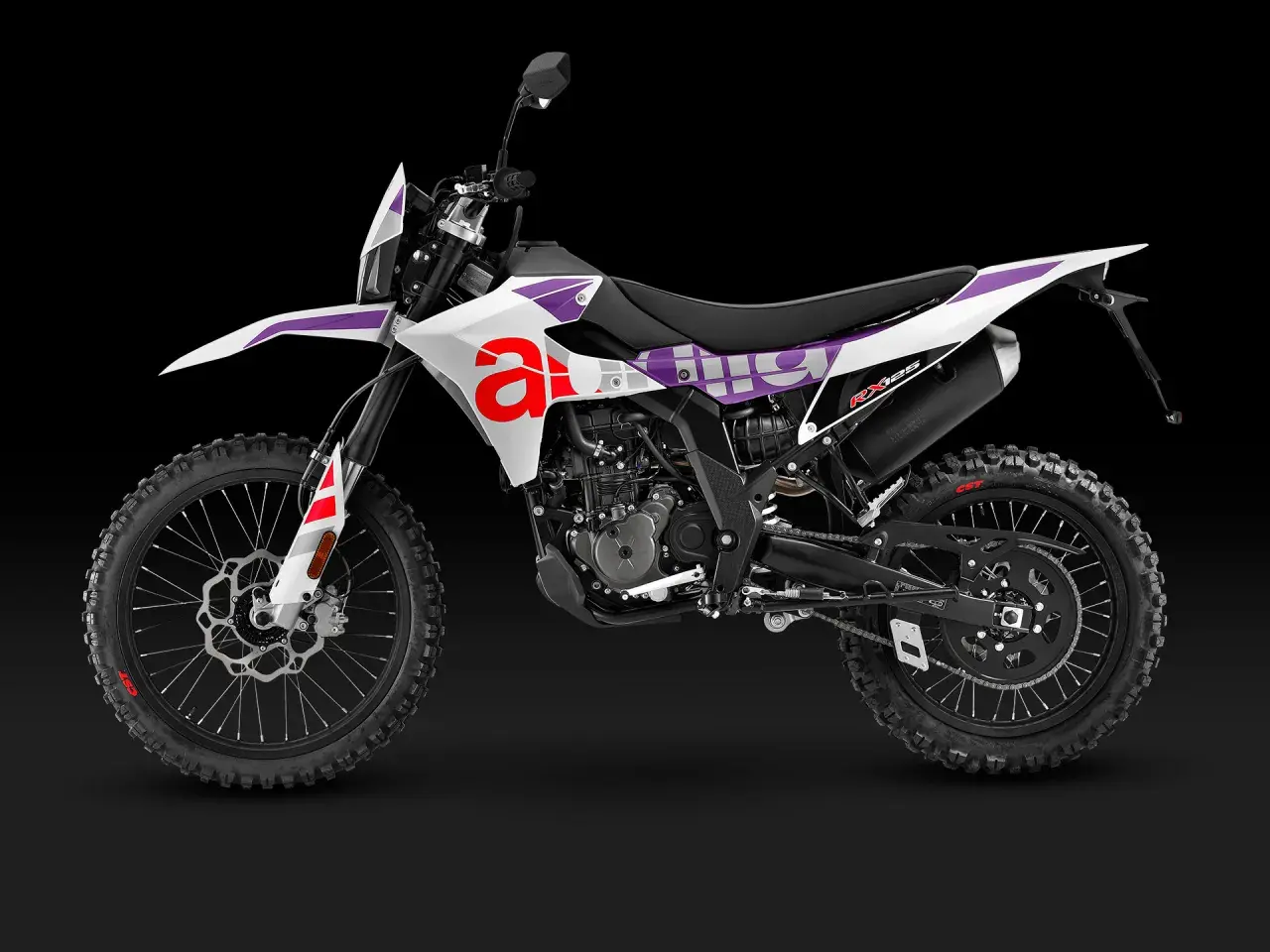 Aprilia RX 125, una moto de cross blanca con detalles morados y rojos. ¡Ideal para tus aventuras off-road!